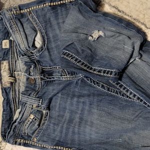 Women's distressed slim boot cut jeans.